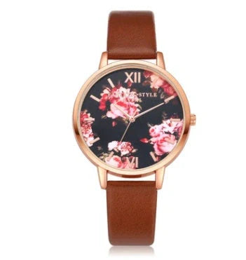 Rose gold quartz wrist watch with leather strap for women