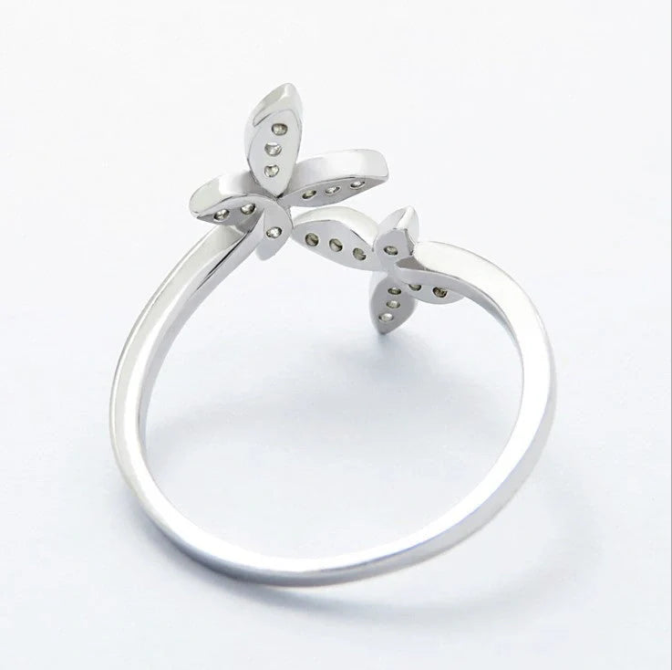 Sterling Silver Adjustable Butterfly Ring with gem accents on a white background