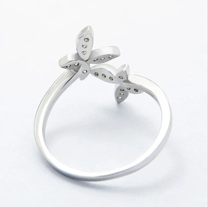 Sterling Silver Adjustable Butterfly Ring with gem accents on a white background
