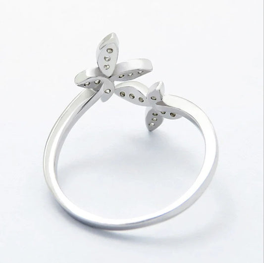 Sterling Silver Adjustable Butterfly Ring with gem accents on a white background