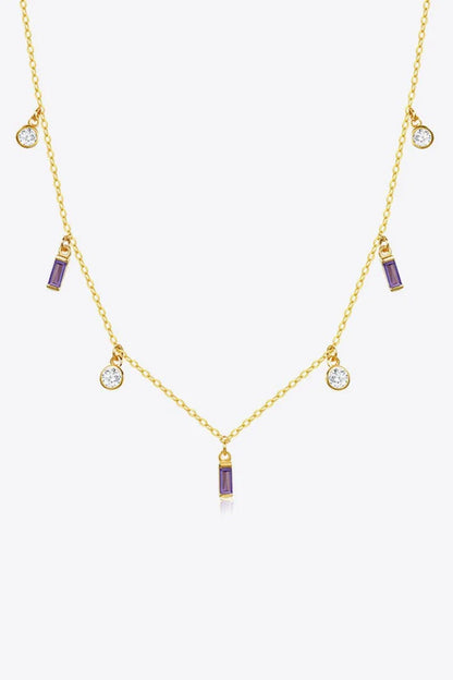 Elegant 18K gold-plated multi-charm chain necklace with delicate charms and a minimalist design