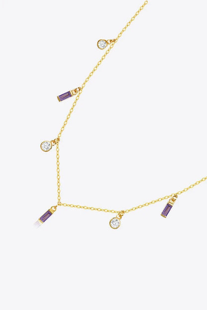 Elegant 18K gold-plated multi-charm chain necklace with delicate charms and a minimalist design