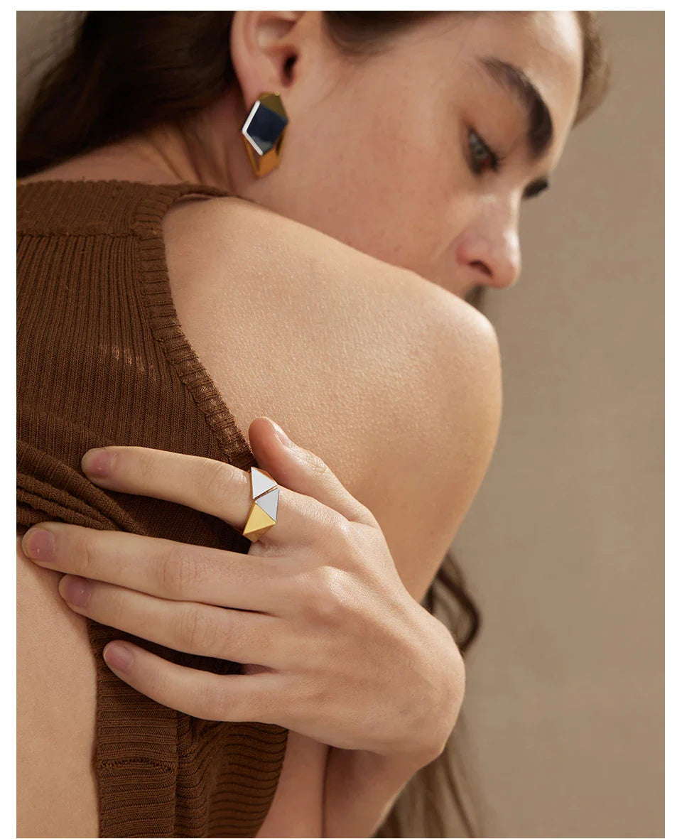 Close-up of a 18K gold-plated ring featuring a genuine meteorite insert with mesmerising natural patterns