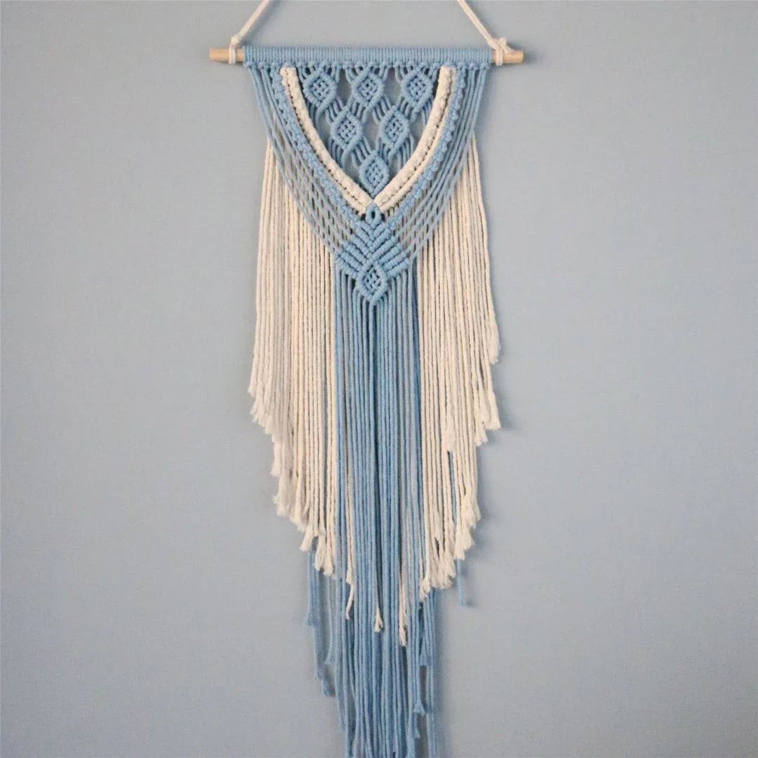 Hand-woven cotton string tapestry with blue and white colours, featuring playful tassels for a modern and rustic wall decoration