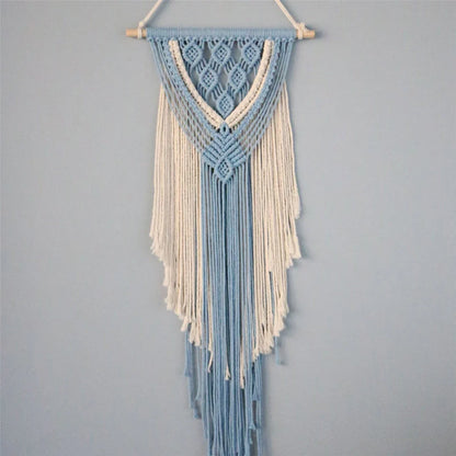Hand-woven cotton string tapestry with blue and white colours, featuring playful tassels for a modern and rustic wall decoration