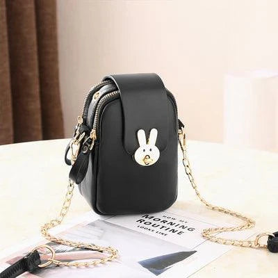Charming mini bag with elegant British-inspired design, crafted from premium PU leather and featuring a secure zipper closure