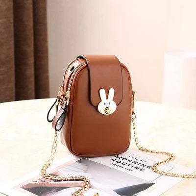 Charming mini bag with elegant British-inspired design, crafted from premium PU leather and featuring a secure zipper closure