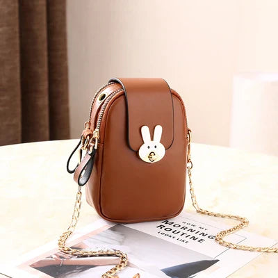 Charming mini bag with elegant British-inspired design, crafted from premium PU leather and featuring a secure zipper closure