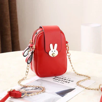 Charming mini bag with elegant British-inspired design, crafted from premium PU leather and featuring a secure zipper closure
