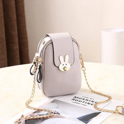 Charming mini bag with elegant British-inspired design, crafted from premium PU leather and featuring a secure zipper closure