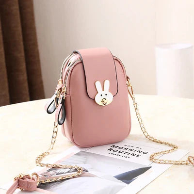 Charming mini bag with elegant British-inspired design, crafted from premium PU leather and featuring a secure zipper closure