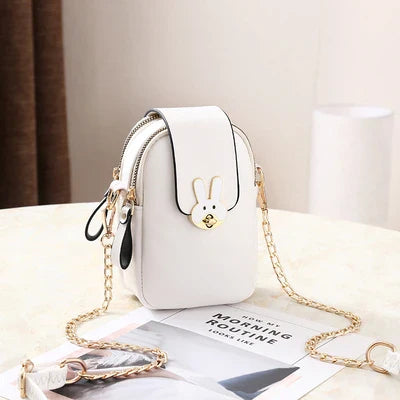 Charming mini bag with elegant British-inspired design, crafted from premium PU leather and featuring a secure zipper closure