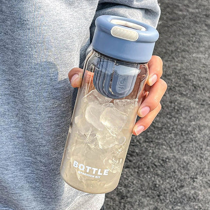 Minimalist modern sports water bottle with tea infuser compartment, in pink colour
