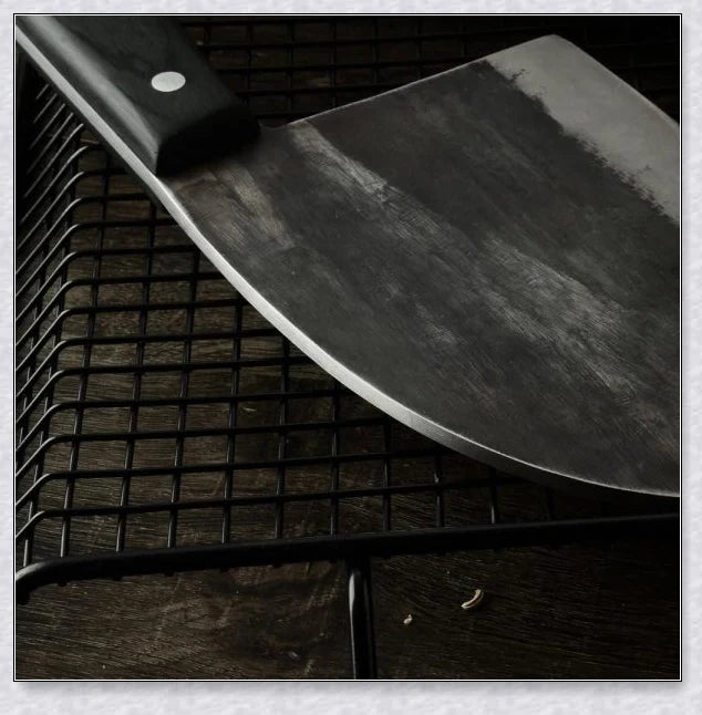 Hand-forged Serbian Butcher Knife with high-carbon steel blade, perfect for chopping, slicing, and hacking through vegetables, meats, and even wood.