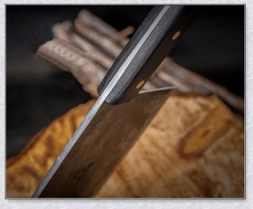 Hand-forged Serbian Butcher Knife with high-carbon steel blade, perfect for chopping, slicing, and hacking through vegetables, meats, and even wood.