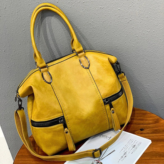 A stylish and spacious leather shoulder messenger bag in a variety of colours, featuring high-quality British craftsmanship