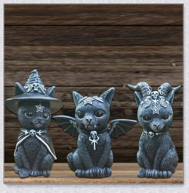Cute and spooky black cat Halloween decorations with horns, wings, and witch hats