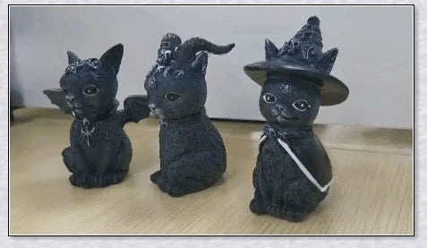 Cute and spooky black cat Halloween decorations with horns, wings, and witch hats