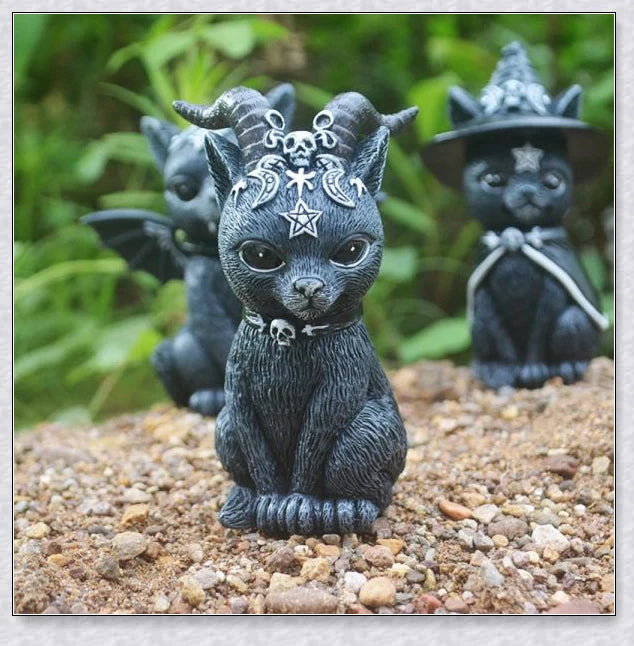 Cute and spooky black cat Halloween decorations with horns, wings, and witch hats
