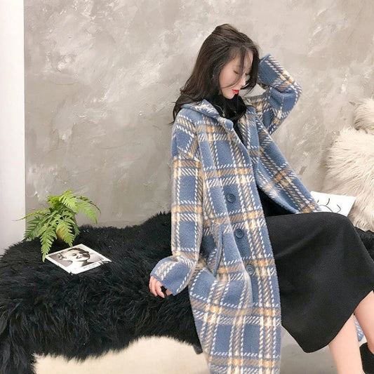 A cosy, thick knitted sweater coat in a classic plaid pattern, featuring a luxurious mink hair blend for superior softness and warmth.
