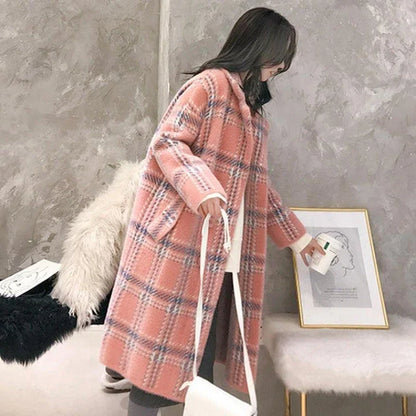 A cosy, thick knitted sweater coat in a classic plaid pattern, featuring a luxurious mink hair blend for superior softness and warmth.