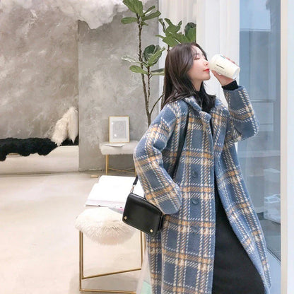 A cosy, thick knitted sweater coat in a classic plaid pattern, featuring a luxurious mink hair blend for superior softness and warmth.