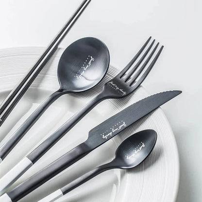 Elegant Nordic Stainless Steel Cutlery Set with a sleek black and white design, including knife, fork, spoon, and chopsticks
