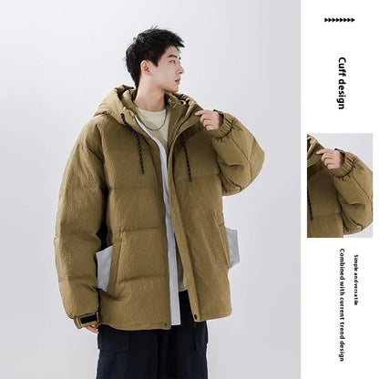 A cosy, black 90% white duck down jacket with a streamlined, modern design, perfect for navigating the ever-changing British weather.