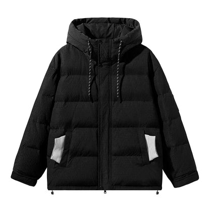 A cosy, black 90% white duck down jacket with a streamlined, modern design, perfect for navigating the ever-changing British weather.