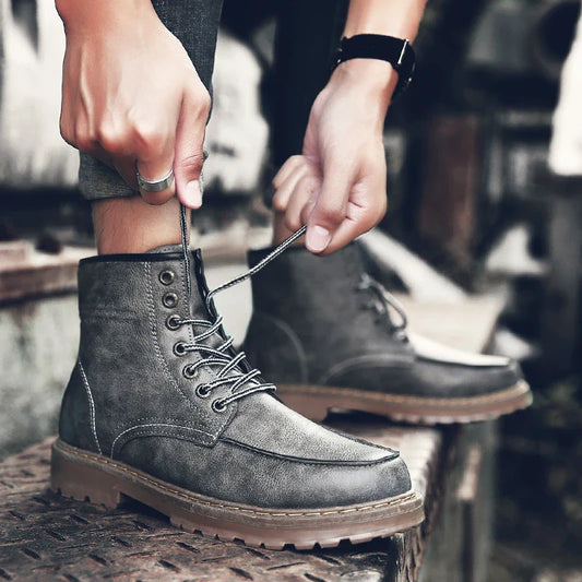 A pair of stylish and comfortable Martin boots for men, featuring a sleek PU upper and a durable rubber sole for everyday casual wear.
