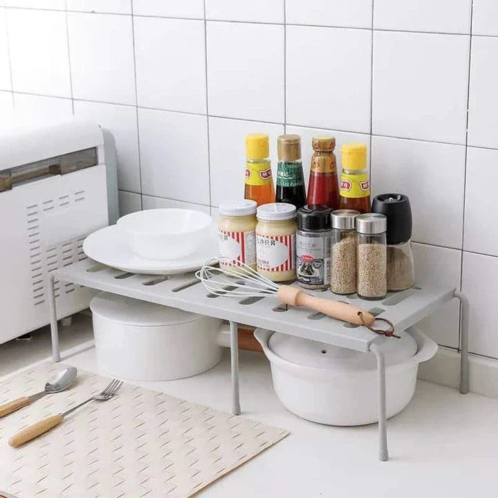 Premium white kitchen storage shelf with a modern and sleek design, providing ample storage space for kitchen essentials.