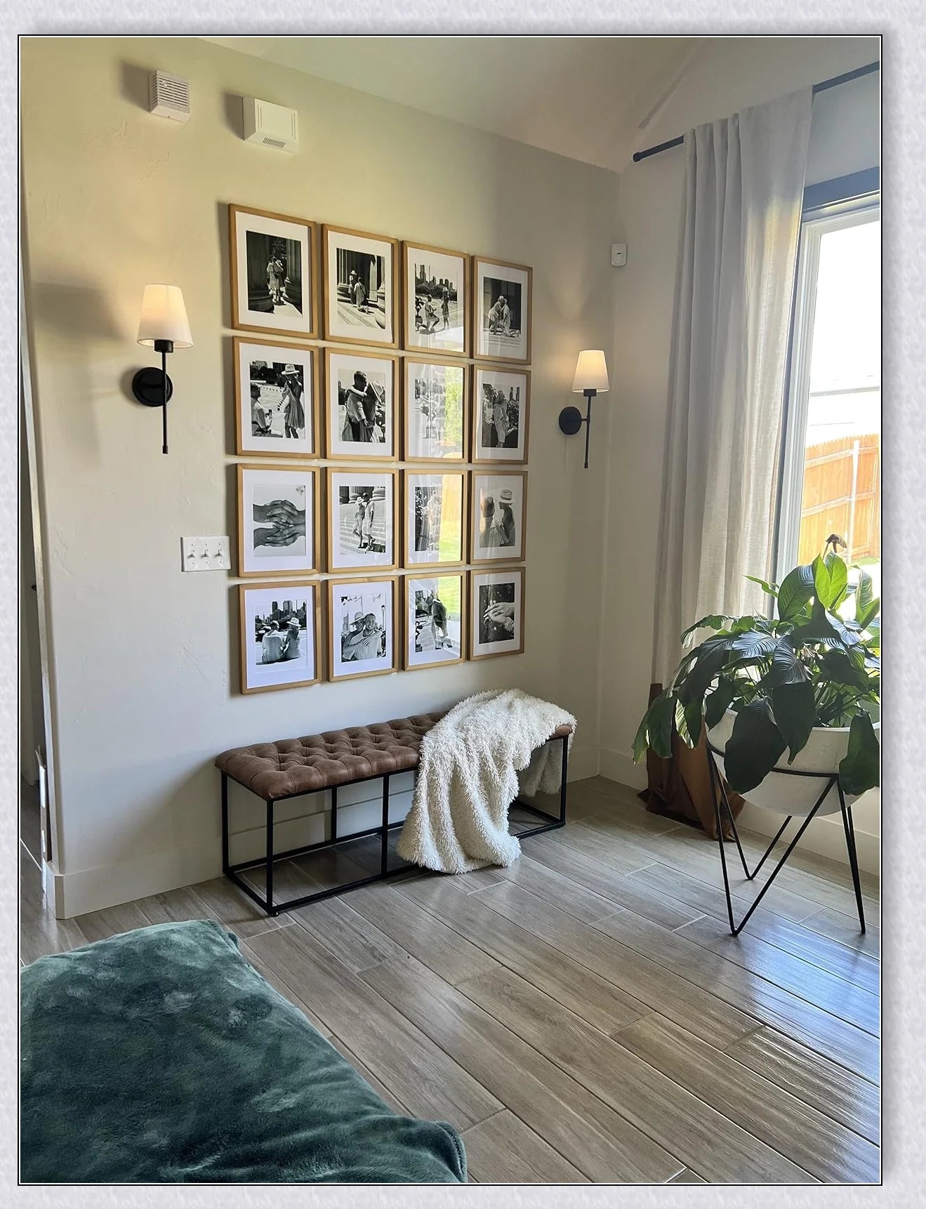 A modern, black and white wireless wall lamp with a fabric shade, providing elegant lighting for a living room or bedroom.