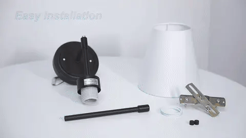 A modern, black and white wireless wall lamp with a fabric shade, providing elegant lighting for a living room or bedroom.