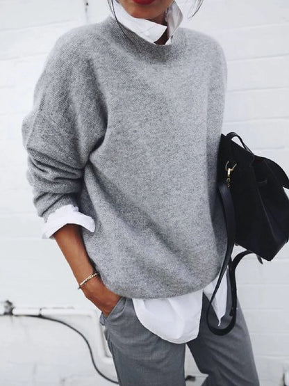 A long sleeve knitted jumper in various solid colours, including light gray, black, khaki, blue, and pink