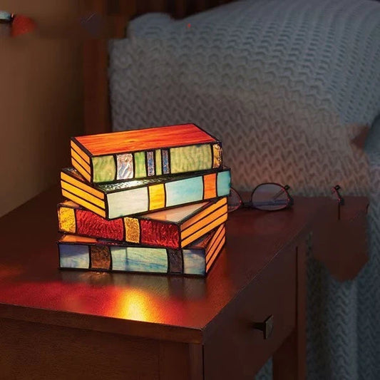 Elegant stacked book lamp with warm, ambient lighting for a cozy reading nook