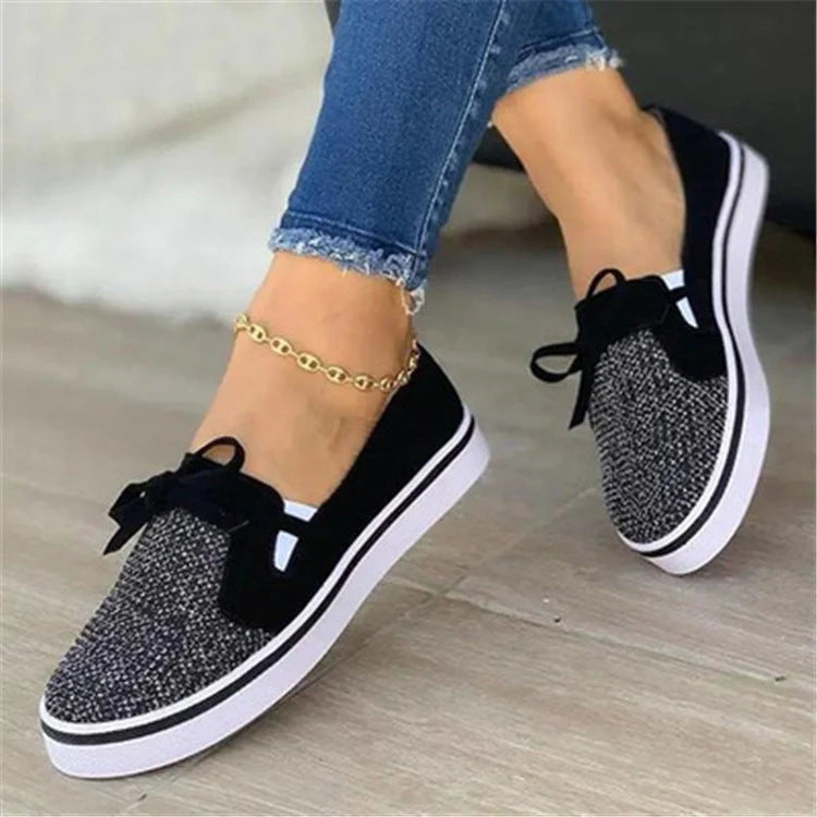 Women's white lace-up canvas flat shoes with cross straps