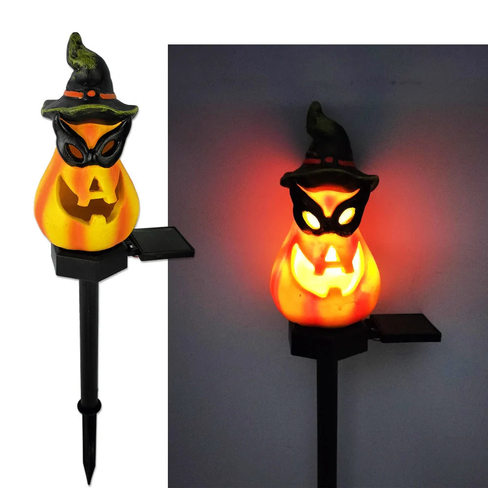 Solar-powered Halloween pumpkin lanterns in garden setting