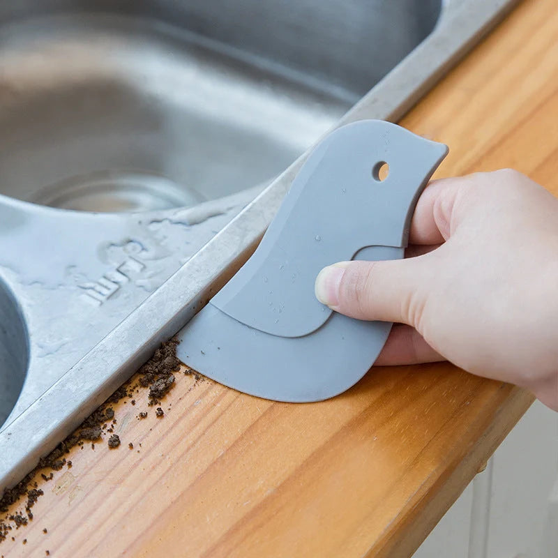 Penguin-shaped soft blade kitchen scraper for efficient cleaning