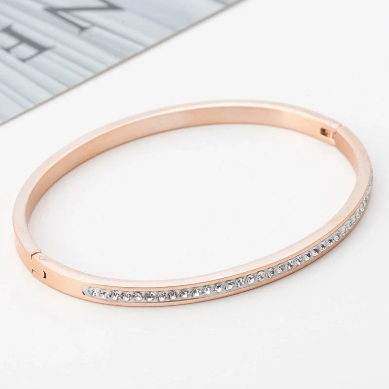 Single row stainless steel bracelet with diamond opening in gold, rose gold, or steel colour