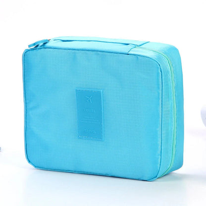 Premium toiletry bag with waterproof divider, multi-grid pockets, and durable Oxford cloth construction