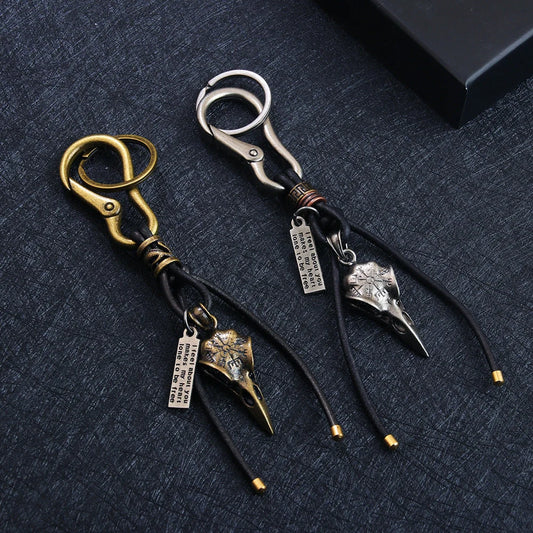 Retro leather keychain with lobster clasp and skull motif in bronze and silver