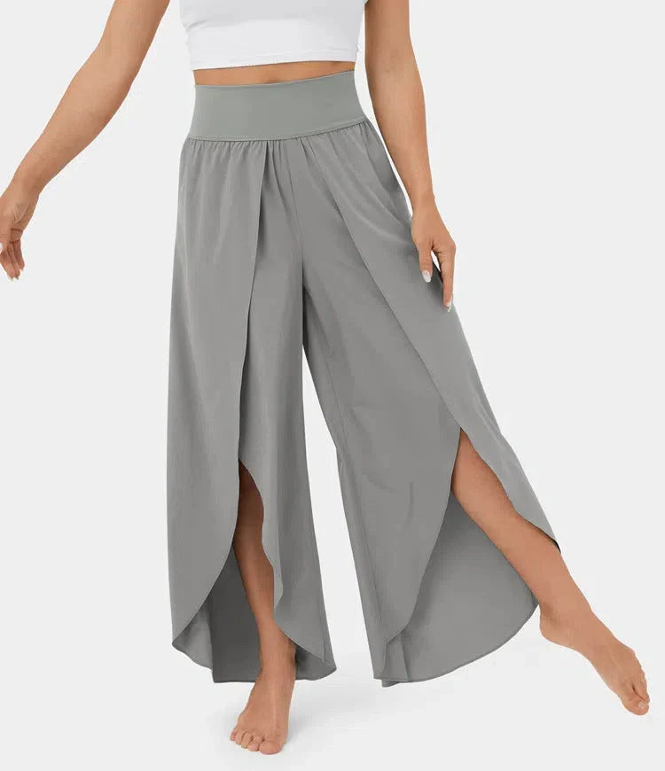 Versatile high-waist split-leg yoga trousers in a variety of colours, featuring a wide-leg silhouette and elasticated waistband for comfort and style.