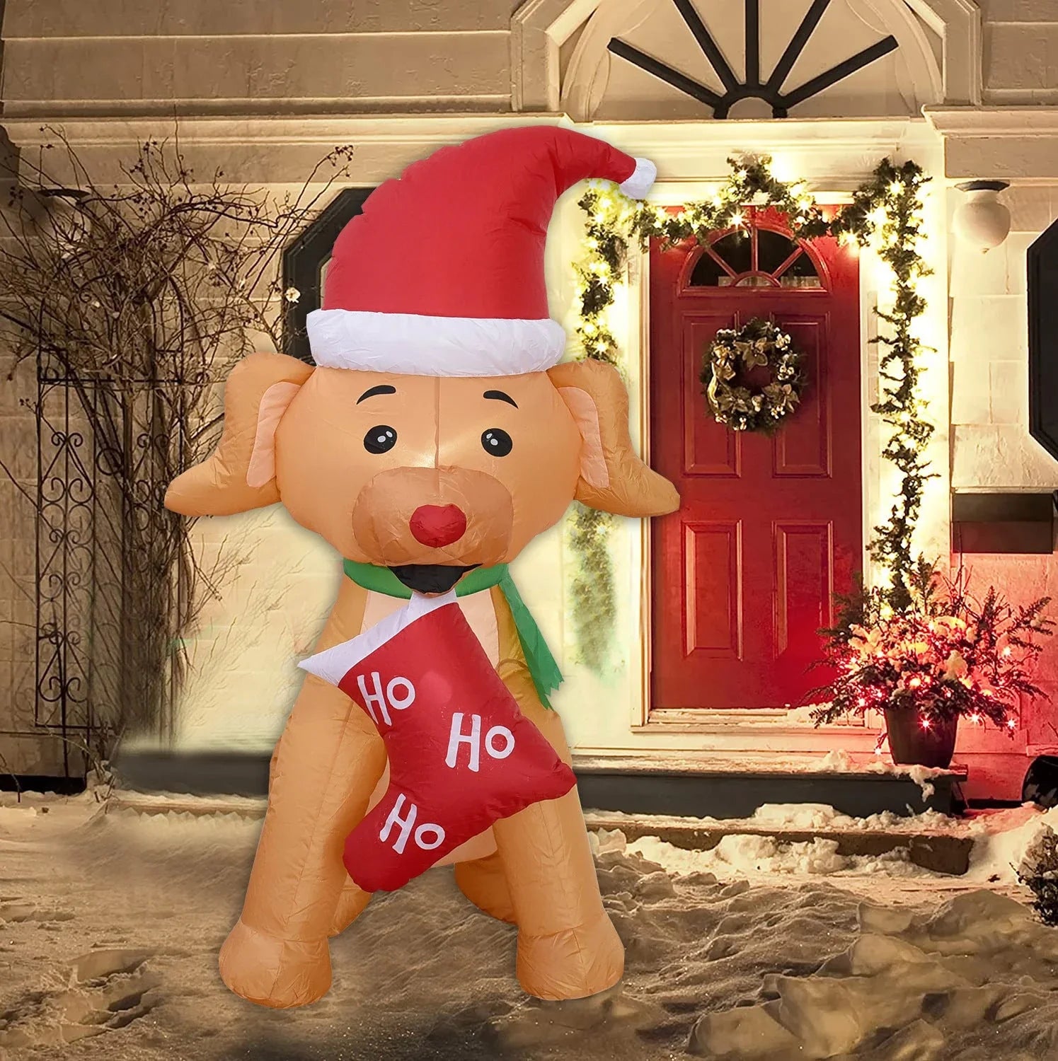 Inflatable Christmas bear decoration with LED lights, sand bag, and ground stakes for secure outdoor display