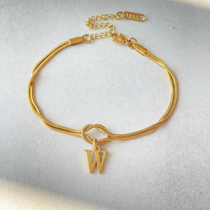 Personalised gold and silver love knot bracelets for couples, perfect as Valentine's Day gifts.