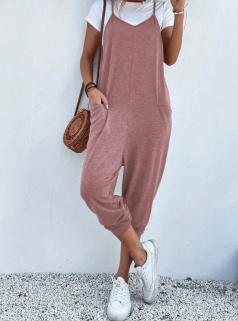 Sleeveless sling jumpsuit in various colours, showcasing versatile design and loose-fitting silhouette