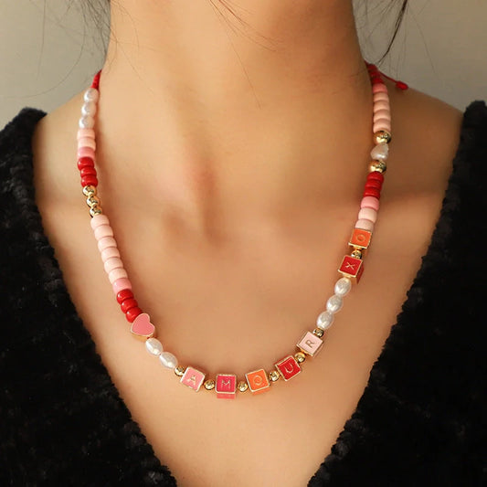 Elegant necklace and bracelet set with delicate beads and English letter charms, crafted with premium alloy materials