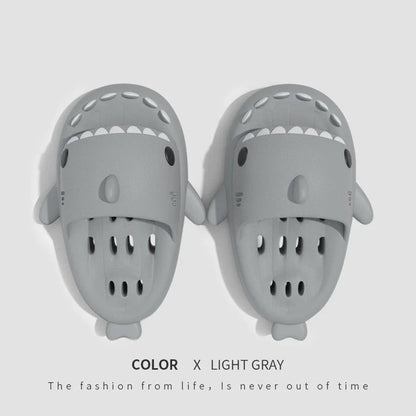 Fashionable shark-themed shower slides with drainage holes, featuring a realistic shark design, quick-drying EVA material, and non-slip traction.