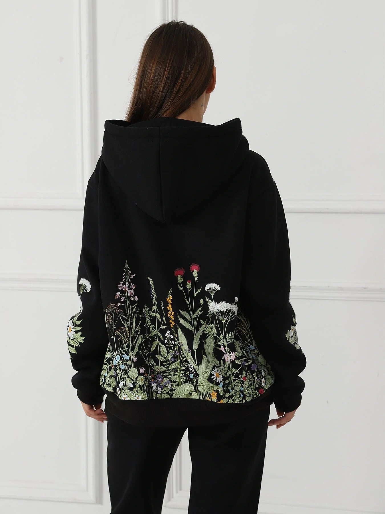 Women's floral long sleeved sweatshirt in black, blue, and apricot