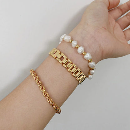 Stylish titanium steel bracelet watch for women with geometric design and adjustable length.