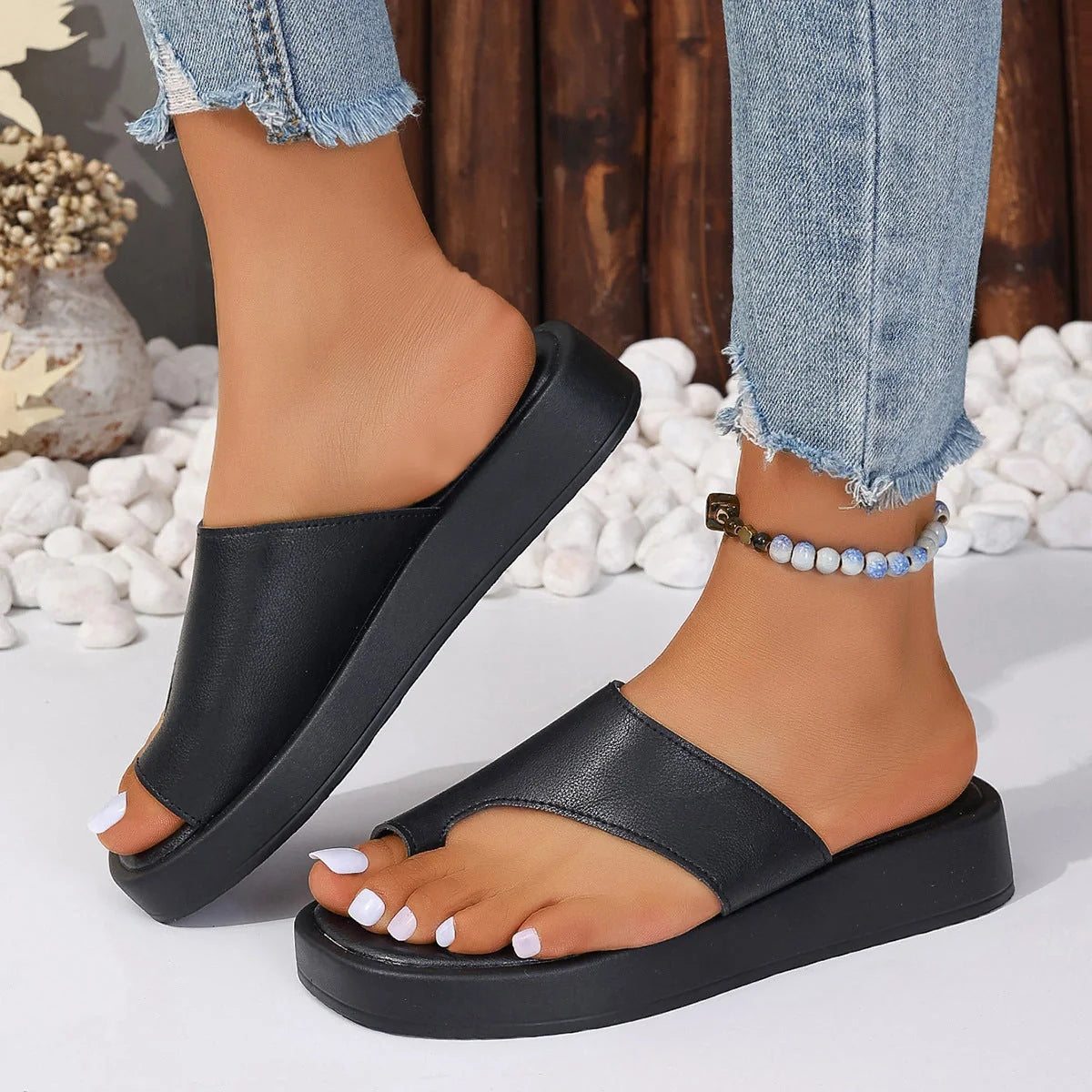 Stylish thick-soled clip-toe slippers for women in various colours, perfect for summer casual wear.